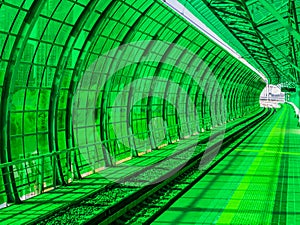 Green-walled platform in modern metro station, Moscow, Russia