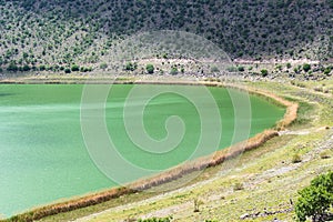 green water of NarlÄ±gol Crater Lake in Cappadocia