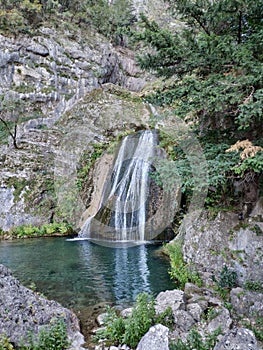 Green waterfall in autumn photo