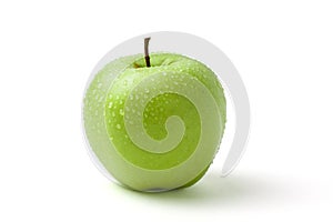 Green wet apple with water drops on white background