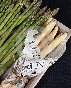 Green and white asparagus. Local produce for sale displayed at the market