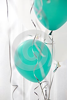 Green and white balloons in the party