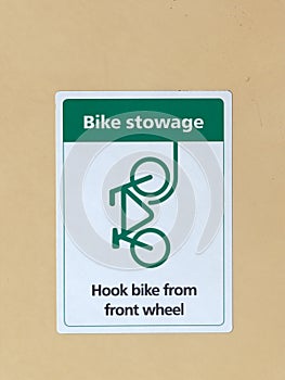 Green and White Bike Stowage Sign on Public Transport