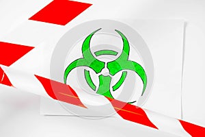 Green and white biohazard sign of biological threat alert with signal tape on the wall