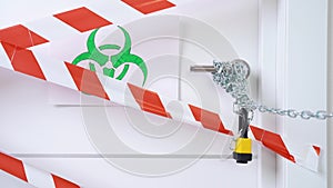 Green and white biohazard sign of biological threat alert with signal tape on the on a white door with a yellow lock. Door handle