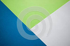 Green, white and blue background diagonally divided