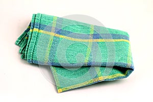 Green white checkered dishcloth, wiper on white backgro