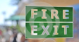 Green and white fire exit sign