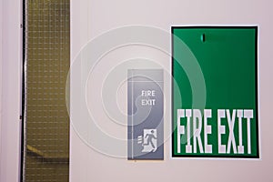 Green and white fire exit sign