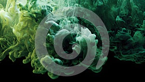 Green and white ink diffusing in water, forming swirling clouds.