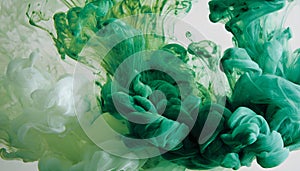 Green and white ink diffusing in water, forming swirling clouds.