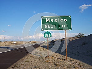 Green and White Mexico Exit Road Sign