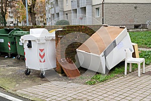 Green and white selective waste collection bins