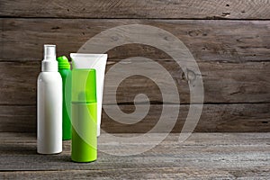 Green and white spray containers