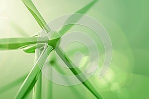 Green and white windmill wind turbine generating electricity with colorful lights in a clear sky