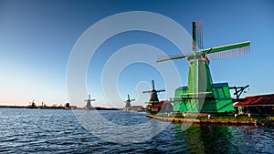 Green windmills in riverside of Rotterdam channel .Ecological engineering. Environmentally friendly solutions. Beauty of