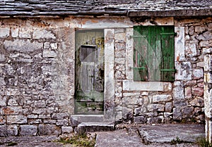 Green window and door on old traditional house