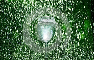 Green wine glass rain drop