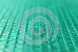 Green wired net surface with blurred background. Advertising backdrop