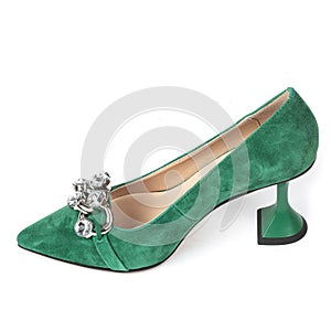 Green women's suede shoes with high heels with a beige insole decorated with shiny crystals on the front on a white