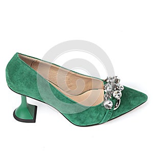 Green women's suede shoes with high heels with a beige insole decorated with shiny crystals on the front on a white