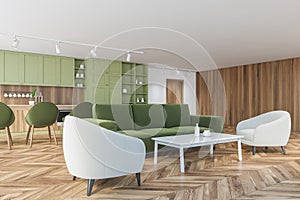 Green and wooden apartment with sofa and kitchen, furniture on wooden parquet