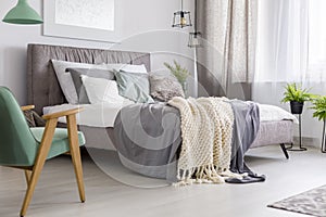 Green wooden chair in bedroom