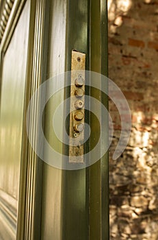 Green wooden door with a lock