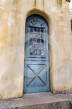 A green wooden door at the Park and National Palace of Pena, a UNESCO World Heritage Site in Sintra