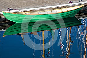 Green wooden row boat