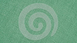 Green woven surface close-up. Linen texture. Fabric background. Textured braided wallpaper. Macro