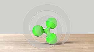 Green xrp ripple gold sign icon on wood table white background. 3d render isolated illustration, cryptocurrency, crypto, business