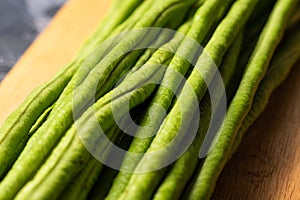 Green yard long bean on wood cutting board