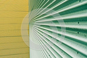 Green and yellow corrugated metal sheet wall background texture