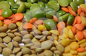 Green and yellow dried Peas and brown and orange lentils