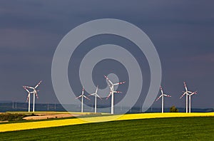 Green and yellow fields with Wind turbines generating electricity