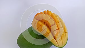 Green and yellow mangoes in summer