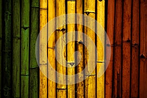 Green yellow red on Bamboo wall texture  Reggae background concept photo