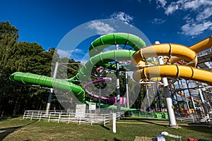 Green and yellow water slide in aquapark