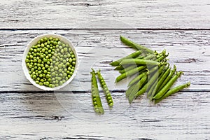 Green young peas on a table