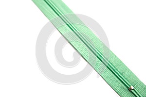 Green zipper isolated on white background