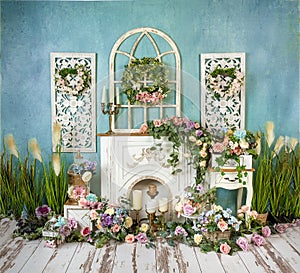 Greenery decorations with lavender, pink, blue flowers and fireplace, romantic mood photo