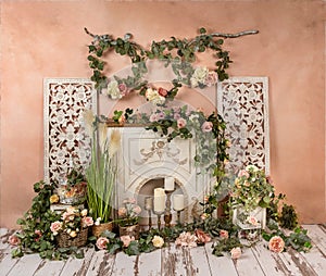 Greenery decorations with peach, pink, flowers and fireplace, romantic mood