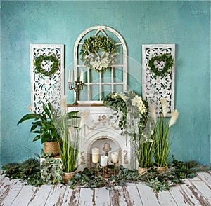 Greenery decorations with white flowers and fireplace, romantic mood