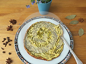 Greenery omelette with dandelions stalks and spices