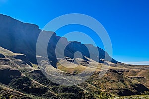 Greenery in Sani pass under blue sky near kingdom of Lesotho South Africa border near KZN and Midlands meander