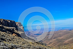 Greenery in Sani pass under blue sky near kingdom of Lesotho South Africa border near KZN and Midlands meander