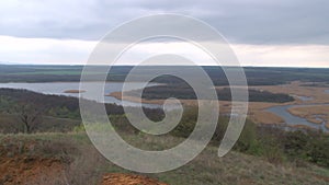 Greengrass landscape, river and couple of trees