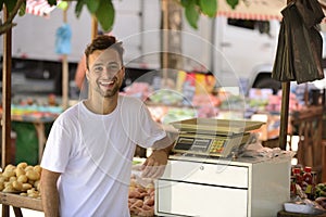 A greengrocer at the cashier