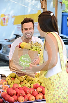 Greengrocer selling organic fruits and vegetables.